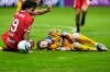 Tigres' Marcelo Flores, right, grimaces in pain past Toluca's Santiago Simon during the CONCACAF Champions Cup final soccer match in Toluca, Mexico, Saturday, May 30, 2026. (AP Photo/Fernando Llano)