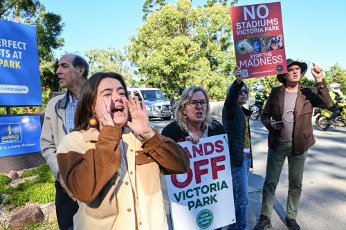 Protesters react at the site of the 2032 Olympic Stadium at Brisbane's Victoria Park, Australia, Monday, June 1, 2026. (Darren England/AAP Image via AP)