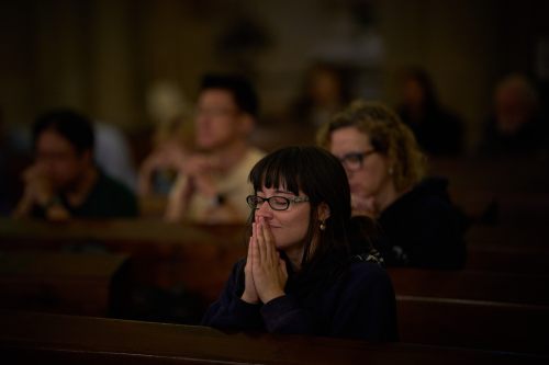 Parishioners pray during a mass in the crypt of the Sagrada Familia in Barcelona, Spain, Friday, May 15, 2026. (AP Photo/Emilio Morenatti)