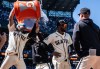 Seattle Mariners' J.P. Crawford, left, douses Victor Robles, second from right, after a baseball game against the Arizona Diamondbacks, Sunday, May 31, 2026, in Seattle. (AP Photo/Stephen Brashear)