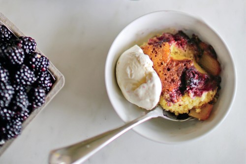 This image released by Voracious shows a recipe for cast-iron fruit cake from the cookbook “The Seasoned Life” by Ayesha Curry. (Caroline Egan/Voracious via AP)