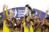 Scarlett Camberos of Mexico's America, center, lifts the trophy after winning the Women's CONCACAF Champions Cup final soccer match against The United States' Washington Spirit in Pachuca, Mexico, Saturday, May 23, 2026.(AP Photo/Fernando Llano)