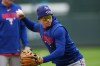 Texas Rangers left fielder Sam Haggerty warms up before a baseball game againsdt the Colorado Rockies, Tuesday, May 19, 2026, in Denver. (AP Photo/David Zalubowski)