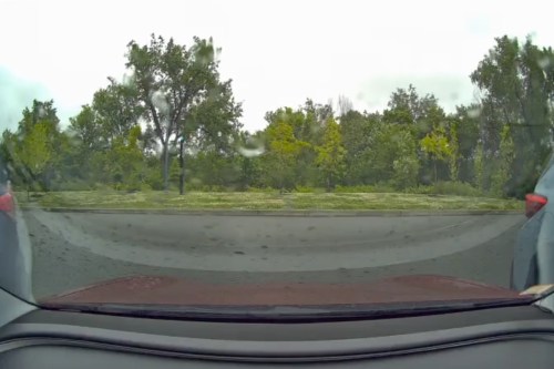This image taken from video shows a view from a car dashcam when a meteor produced two loud booms over Cambridge, Mass., Saturday, May 30, 2026. (Stanley Fung via AP)