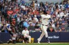 Milwaukee Brewers' Brice Turang watches his two-run triple during the second inning of a baseball game against the San Francisco Giants, Monday, June 1, 2026, in Milwaukee. (AP Photo/Aaron Gash)