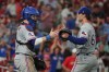 Texas Rangers pitcher Jacob Latz, right, and catcher Danny Jansen celebrate a victory over the St. Louis Cardinals following a baseball game Monday, June 1, 2026, in St. Louis. (AP Photo/Jeff Roberson)