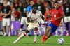 Canada midfielder Alphonso Davies (19) and Chile striker Marcos Bolados, right, compete for the ball during the second half of a Copa America Group A soccer match, Saturday, June 29, 2024, in Orlando, Fla. (AP Photo/Phelan M. Ebenhack)