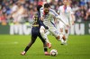FILE - Lyon's Rayan Cherki, right, is challenged by Reims' Mamadou Diakhon during the French League One soccer match between Lyon and Reims at the Groupama stadium in Decines, outside Lyon, central France, Feb. 9, 2025. (AP Photo/Laurent Cipriani, File)