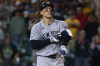 New York Yankees' Aaron Judge reacts after drawing a bases loaded walk to score a run during the ninth inning of a baseball game against the Athletics Saturday, May 30, 2026, in West Sacramento, Calif. (AP Photo/Scott Marshall)