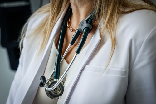 A doctor wears a lab coat and stethoscope in an exam room on Friday, July 14, 2023. THE CANADIAN PRESS/Jeff McIntosh