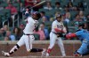 Atlanta Braves second baseman Ozzie Albies (1) hits a sacrifice fly for an RBI in the first inning of a baseball game against the Toronto Blue Jays, Tuesday, June 2, 2026, in Atlanta. (AP Photo/Mike Stewart)
