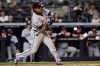 Cleveland Guardians' José Ramírez hits a run scoring double during the seventh inning of a baseball game against the New York Yankees, Tuesday, June 2, 2026, in New York. (AP Photo/Adam Hunger)