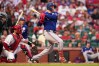 Texas Rangers' Joc Pederson follows through on an RBI double during the fifth inning of a baseball game against St. Louis Cardinals Tuesday, June 2, 2026, in St. Louis. (AP Photo/Jeff Roberson)