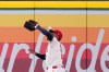 Los Angeles Angels right fielder Jo Adell misplays a ball hit by Colorado Rockies' TJ Rumfield that hit him in the head and then bounced out for a solo home run during the fourth inning of a baseball game Tuesday, June 2, 2026, in Anaheim, Calif. (AP Photo/Mark J. Terrill)