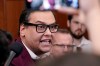 FILE - Rep. George Santos, R-N.Y., talks to reporters as House Republicans hold a caucus meeting at the Capitol in Washington, Oct. 13, 2023. (AP Photo/Mariam Zuhaib, File)