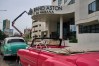 Workers repair the sign at the Grand Aston Hotel in Havana, Wednesday, June 3, 2026. (AP Photo/Ramon Espinosa)