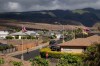 FILE - A child rides a bicycle on Aipuni Street in the Villages of Leiali'i, a Hawaiian homestead community, on Monday, Sept. 25, 2023, in Lahaina, Hawaii. (AP Photo/Mengshin Lin, File)