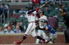 Atlanta Braves' Mauricio Dubón hits a three-run homer in the third inning of a baseball game against the Toronto Blue Jays, Wednesday, June 3, 2026, in Atlanta. (AP Photo/Mike Stewart)