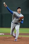 Los Angeles Dodgers pitcher Shohei Ohtani throws against the Arizona Diamondbacks in the first inning of a baseball game, Wednesday, June 3, 2026, in Phoenix. (AP Photo/Rick Scuteri)