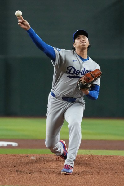 Los Angeles Dodgers pitcher Shohei Ohtani throws against the Arizona Diamondbacks in the first inning of a baseball game, Wednesday, June 3, 2026, in Phoenix. (AP Photo/Rick Scuteri)