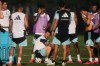 Argentina forward Lionel Messi, sitting, takes a break with teammates during practice for the FIFA World Cup soccer Wednesday, June 3, 2026, in Kansas City, Kan. (AP Photo/Charlie Riedel)