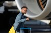 Brazilian soccer player Neymar gives a thumbs up as he disembarks at Newark Liberty International Airport in Newark, N.J., Tuesday, June 2, 2026, as the team arrives ahead of the World Cup soccer tournament. (AP Photo/Seth Wenig)
