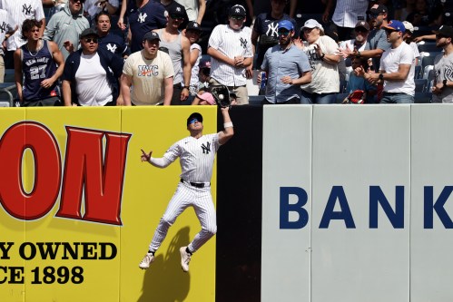 New York Yankees shortstop Max Schuemann makes a catch on a flyout by Cleveland Guardians' Brayan Rocchio during the seventh inning of a baseball game Thursday, June 4, 2026, in New York. (AP Photo/Adam Hunger)
