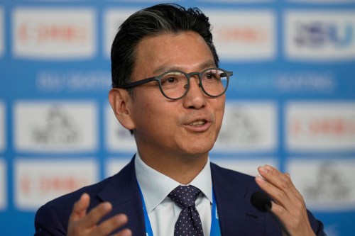 FILE - International Skating Union President Jae Youl Kim address media during the ISU Skate to Milano figure skating qualifier 2025 in Beijing, China, Sept. 19, 2025. (AP Photo/Mahesh Kumar A., File)