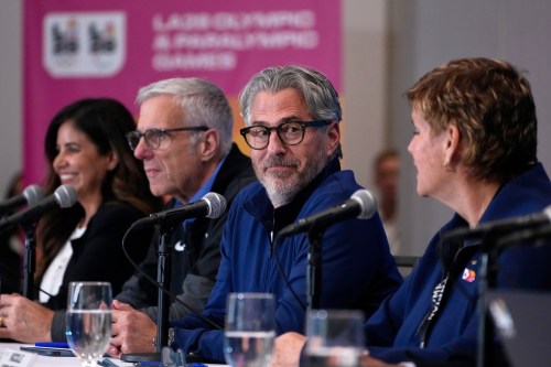 Members of LA28 and the International Olympic Committee, from left, Jacie Prieto Lopez, Vice President Communications at LA28 Olympic & Paralympic Games, Reynold Hoover, LA28 Chief Executive Officer, Casey Wasserman, LA28 Chairperson and President and Nicole Hoevertsz, Chair, IOC Coordination Commission for LA28, sit during a news conference Thursday, June 4, 2026, in Los Angeles. (AP Photo/Mark J. Terrill)