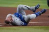 Los Angeles Dodgers' Max Muncy reacts after colliding with Arizona Diamondbacks first baseman Ildemaro Vargas in the fifth inning of a baseball game, Thursday, June 4, 2026, in Phoenix. (AP Photo/Rick Scuteri)