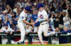 Chicago Cubs' Pete Crow-Armstrong, right, celebrates with third base coach Quintin Berry after hitting a solo home run during the sixth inning of a baseball game against the Athletics in Chicago, Thursday, June 4, 2026. (AP Photo/Nam Y. Huh)