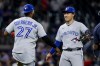 Toronto Blue Jays' Vladimir Guerrero Jr., left, celebrates with Kazuma Okamoto, right, after the Blue Jays defeated the Atlanta Braves in a baseball game, Thursday, June 4, 2026, in Atlanta. (AP Photo/Erik S. Lesser)