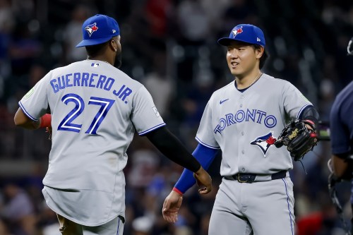 Toronto Blue Jays' Vladimir Guerrero Jr., left, celebrates with Kazuma Okamoto, right, after the Blue Jays defeated the Atlanta Braves in a baseball game, Thursday, June 4, 2026, in Atlanta. (AP Photo/Erik S. Lesser)