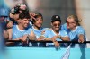 Manchester City's Erling Haaland, right, celebrates with teammates on an open top bus during a parade to celebrate the achievements of the Manchester City men's and women's teams this season in Manchester, Monday, May 25, 2026.(AP Photo/Alastair Grant)