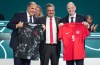 FIFA Vice-President and CONCACAF President Victor Montagliani, from left to right, Canada Soccer President Peter Augruso and FIFA President Gianni Infantino pose with Canadian team jerseys that were presented to Montagliani and Infantino, during the 76th FIFA Congress in Vancouver, on Thursday, April 30, 2026. THE CANADIAN PRESS/Darryl Dyck