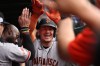 The San Francisco Giants' Matt Chapman celebrates in the dugout after hitting a grand slam during the fourth inning of a baseball game against the Chicago Cubs, Friday, June 5, 2026, in Chicago. (AP Photo/Geoff Stellfox)