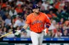 Houston Astros designated hitter Isaac Paredes flips his bat as he watches his hit against the Athletics during the third inning of a baseball game Friday, June 5, 2026, in Houston. (AP Photo/Michael Wyke)