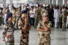 Security personnel stand guard before the arrival of Abhijeet Dipke, founder of Cockroach Janta at Indira Gandhi International airport in New Delhi, India, Saturday, June 6, 2026. (AP Photo/Manish Swarup)