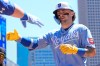 Kansas City Royals' Carter Jensen celebrates his solo home run against the Minnesota Twins in the first inning of a baseball game Saturday, June 6, 2026, in Minneapolis. (AP Photo/Bruce Kluckhohn)