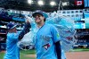 Toronto Blue Jays' Myles Straw, left, douses teammate Ernie Clement with sports drink following MLB baseball action against the Baltimore Orioles, in Toronto, Saturday, June 6, 2026. THE CANADIAN PRESS/Frank Gunn