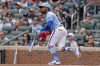 Atlanta Braves' Ozzie Albies hits an RBI sacrifice fly ball against the Pittsburgh Pirates during the first inning of a baseball game, Saturday, June 6, 2026, in Atlanta. (AP Photo/Erik S. Lesser)
