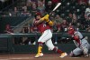 Arizona Diamondbacks' Gabriel Moreno (14) hits against the Washington Nationals in the first inning of a baseball game, Sunday, June 7, 2026, in Phoenix. (AP Photo/Rick Scuteri)