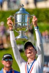 Nelly Korda holds up the trophy after winning the U.S. Women's Open golf tournament Sunday, June 7, 2026, in the Pacific Palisades area of Los Angeles. (AP Photo/Ashley Landis)