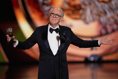 John Lithgow accepts the award for best performance by a leading actor in a play for 