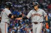 San Francisco Giants' Jung Hoo Lee, right, of South Korea, gets a high-five from Luis Arraez during the first inning of a baseball game against the Chicago Cubs in Chicago, Sunday, June 7, 2026. (AP Photo/Nam Y. Huh)