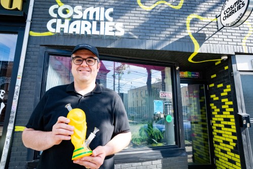 Sean Kady, owner of Cosmic Charlies, poses for a photograph holding a bong resembling the FIFA World Cup trophy outside his shop on Queen Street West in Toronto on Thursday, June 4, 2026. THE CANADIAN PRESS/Arlyn McAdorey