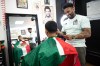 Ramon Pelayo cuts Diego Valderrama's hair at La Familia Mexican Barber in Vancouver, on Wednesday, June 3, 2026. THE CANADIAN PRESS/Ethan Cairns