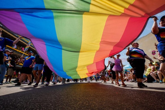 People attend the Pride parade in downtown Winnipeg on Sunday. (John Woods / Free Press)