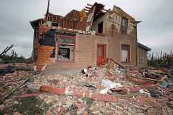 Brian Brown grabbed his wife, Bernadine, and pulled her to the floor with him as the tornado blew over them.
