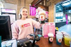 MIKAELA MACKENZIE / FREE PRESS 
                                Kalila Sullivan serves up the Coke Colada at Sodie&rsquo;s Dirty Sodas, located at the Forks Trading Company.
